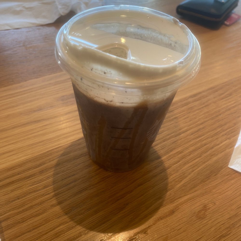 a cup of coffee on a table a cup of coffee on a table