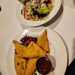 J Liu Restaurant & Bar - CRAB RANGOONS (5) HAND-FOLDED WONTONS FILLED WITH CRAB MEAT, ONIONS, CARROTS, CELERY, AND CREAM CHEESE FRIED