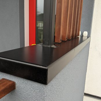 Pioneer Welding Services - Custom parapet flashing and bracket for wood slat screen - Metal Fabricators Near Me