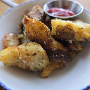 Tupelo Honey Southern Kitchen & Bar - Rosemary and Parmesan Crispy Potatoes - New American Near Me - Frisco, Texas Tupelo Honey Southern Kitchen & Bar - Rosemary and Parmesan Crispy Potatoes - New American Near Me - Frisco, Texas