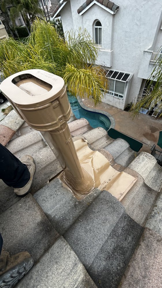 Slide of J&E Roofing Services