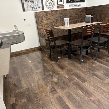 The Yard Milkshake Bar - Water leaking from the bathroom and some of the trash that was at every table. - Ice Cream & Frozen Yogurt Near Me - Destin, Florida