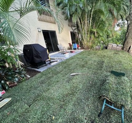 Patio Remodel - This remodel was done on a patio that was filled with trees and bushes and completely covering the beautiful view of the lake that’s behind the house. The owner requested us to clear it out and add new tiles and fake grass. That’s exactly what we did.