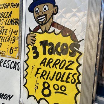 Rambo’s Tacos - a man holding a sign - Mexican Near Me - Los Angeles, California Rambo’s Tacos - a man holding a sign - Mexican Near Me - Los Angeles, California