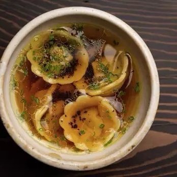 Enclos - A dish of tortellini en brodo at Enclos in Sonoma, Calif., made with black truffles and chives. - French Near Me - Sonoma, California Enclos - A dish of tortellini en brodo at Enclos in Sonoma, Calif., made with black truffles and chives. - French Near Me - Sonoma, California
