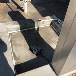 a gas station with a fire hydrant a gas station with a fire hydrant