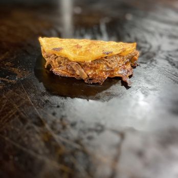 Birria Master - a piece of bread on a grill - Tacos Near Me - Pasadena, California