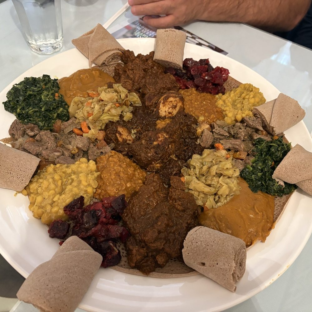 EthioEritrea Restaurant - veggie and meat dishes including Tibs, corn and chicken! - Ethiopian Near Me - Syracuse, New York EthioEritrea Restaurant - veggie and meat dishes including Tibs, corn and chicken! - Ethiopian Near Me - Syracuse, New York