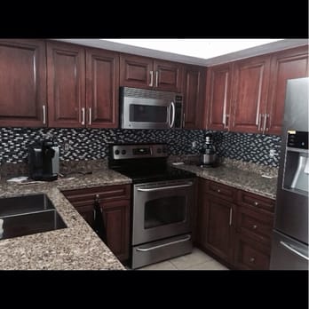 A-1 Custom Mica - Solid wood kitchen! Raised panel doors with custom dark stain. - Cabinetry Near Me - Hollywood, Florida A-1 Custom Mica - Solid wood kitchen! Raised panel doors with custom dark stain. - Cabinetry Near Me - Hollywood, Florida