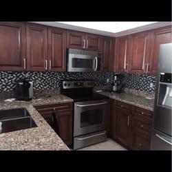 A-1 Custom Mica - Solid wood kitchen! Raised panel doors with custom dark stain.
