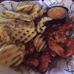 Tenders tossed in spicy barbecue with hot waffle fries and a side of Garlic Buffalo Parmesan wing sauce. Thanks Kelly. Tenders tossed in spicy barbecue with hot waffle fries and a side of Garlic Buffalo Parmesan wing sauce. Thanks Kelly.