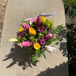 $50 custom arrangement.  All I said was, "my mom likes lilies"...ordered at 6pm, delivered next morning.