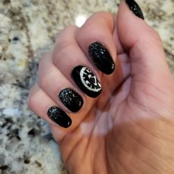 Polished Beauty Salon and Spa - New Years Nails by Shawna. I unfortunately broke my ring finger so had shorten the others.