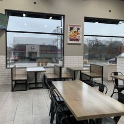 Savvy Sliders - Dine-in options: high-top window view of Greenfield Rd, booths and tables