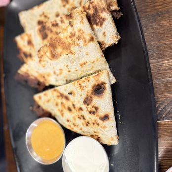 The Bite Of Korea - Bulgogi Quesadilla - delicious yellow sauce very spicy - Korean Near Me - Tucker, Georgia The Bite Of Korea - Bulgogi Quesadilla - delicious yellow sauce very spicy - Korean Near Me - Tucker, Georgia