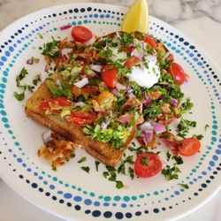 Harvest and Sea - Avocado Toast, Tomato Salsa Medley, Poached Egg.