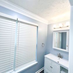 NBH Construction - Grayish blue hall bathroom remodel- side angle