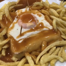 Francesinha with fries and egg