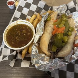 Italian beef with hot and sweet peppers, side au jus and fries Italian beef with hot and sweet peppers, side au jus and fries