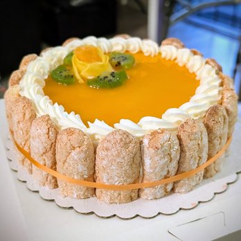 Hopkins Street Bakery - Mango mousse cake with lady fingers around the sides. - Bakeries Near Me - Berkeley, California Hopkins Street Bakery - Mango mousse cake with lady fingers around the sides. - Bakeries Near Me - Berkeley, California