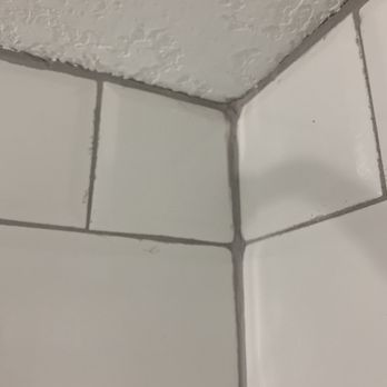 Home Wreckers - a corner of a tiled bathroom - Roofing Near Me - Melbourne, Florida Home Wreckers - a corner of a tiled bathroom - Roofing Near Me - Melbourne, Florida