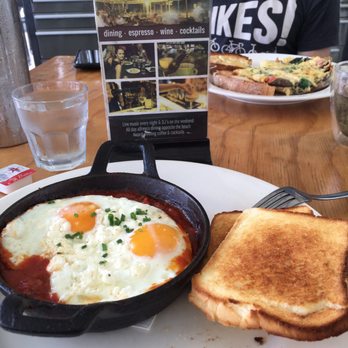 Lot 104 - Spanish Baked Eggs with Gluten Free bread, and an omelette across the table. - Bars Near Me - Mooloolaba, QLD Lot 104 - Spanish Baked Eggs with Gluten Free bread, and an omelette across the table. - Bars Near Me - Mooloolaba, QLD