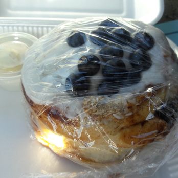 Cafe Amri - An assortment of cinnamon rolls: cinnamon, walnut, blueberry and chocolate chip. Pictured is the to go blueberry with blueberry inside. - Breakfast & Brunch Near Me - Oxnard, California