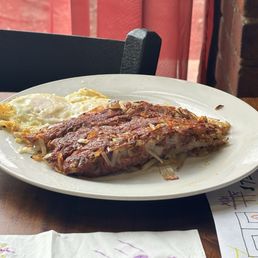 Corned Beef Hash and fried eggs, made with shredded "hash brown" potato.
