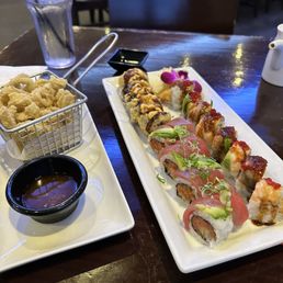 Sakura + Crispy Spicy Salmon Roll + Black Tiger Roll + Fried Calamari Sakura + Crispy Spicy Salmon Roll + Black Tiger Roll + Fried Calamari