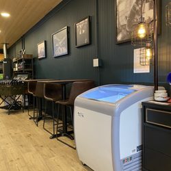 Bonaventure Coffee Roasters - Some of the seating selection, aeronautical lighting fixture and artwork. Grab and go items.