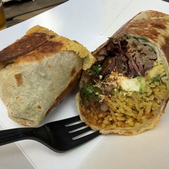 Starland Yard - t-rex burrito - beans, rice, roast poblanos and onions, avocado, cilantro and a crispy cheese shell - Food Trucks Near Me - Savannah, Georgia
