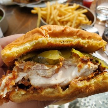 Beast Pizza - a hand holding a half eaten sandwich - Pizza Near Me - Toronto, Ontario Beast Pizza - a hand holding a half eaten sandwich - Pizza Near Me - Toronto, Ontario