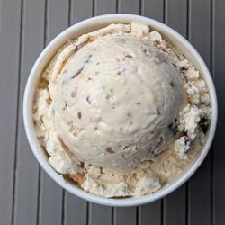 Single Scoop - Reese's Peanut Butter Cup (lid off). Good amount of Reese's flavor in this scoop!