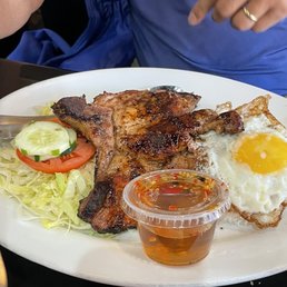 Pork chop with fried egg Pork chop with fried egg