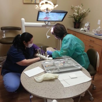 Peninsula Infinite Smiles - Just watching cartoons on Netflix, while getting her teeth cleaned! - General Dentistry Near Me - Belmont, California