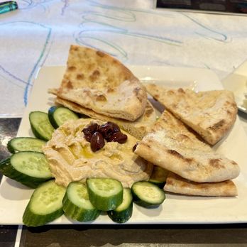 Crust Pizzeria - a plate of pita chips and cucumbers - Pizza Near Me - Carlsbad, California Crust Pizzeria - a plate of pita chips and cucumbers - Pizza Near Me - Carlsbad, California