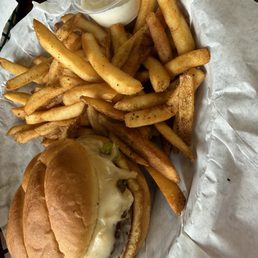 Cheeseburger and fries with homemade ranch dressing along