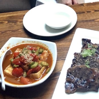 Umi Sake House - Spicy tomato tofu (very good) and garlic short ribs - Sushi Bars Near Me - Seattle, Washington Umi Sake House - Spicy tomato tofu (very good) and garlic short ribs - Sushi Bars Near Me - Seattle, Washington