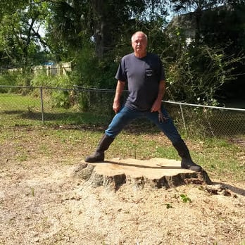 Stumphead Stump Grinding - Grant was able to put each foot to the width of the stump...That's a Big Stump!! - Tree Services Near Me