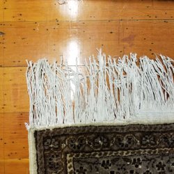 Rocco's Flooring - Fringe Repair on Turkish Wool.  Caught it and back sewn before the rug started to unravel.