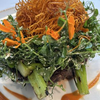 Cafe Marquesa - 16-ounce ribeye, crispy sweet potatoes, pea tendrils, sweet potato-bourbon jus - New American Near Me - Key West, Florida