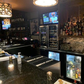 Nosh Wine Lounge - Sitting at bar - Wine Bars Near Me - Omaha, Nebraska Nosh Wine Lounge - Sitting at bar - Wine Bars Near Me - Omaha, Nebraska