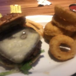 Cheese burger with Swiss cheese and onion rings. (Yep plus a couple of French fries from my daughter's plate).