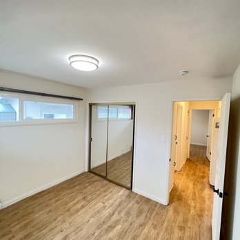 HTA Construction - an empty room with wood floors - General Contractors Near Me - Long Beach, California