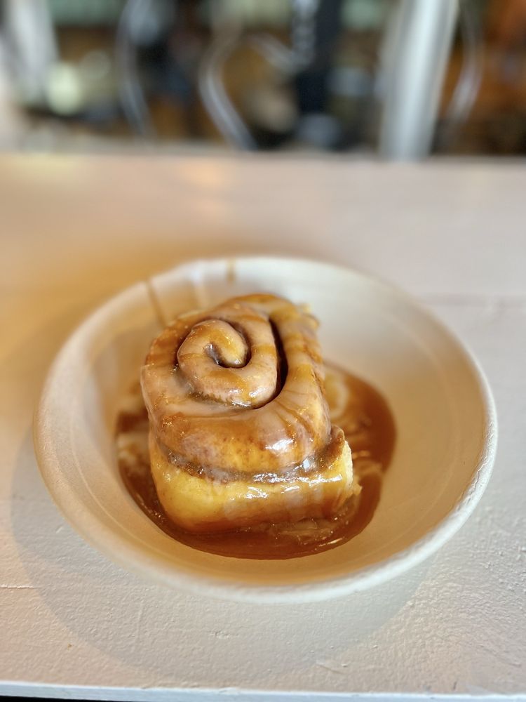 Ooey Gooey Cinnamon Rolls And Cafe Logo