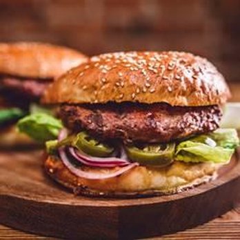 Hometown Xpress - two burgers on a wooden board - Food Delivery Services Near Me - Carlton, Oregon Hometown Xpress - two burgers on a wooden board - Food Delivery Services Near Me - Carlton, Oregon