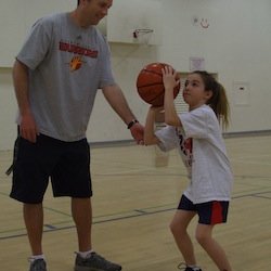 Saratoga Basketball Camp - Explaining the BEEF shooting method to a camper.