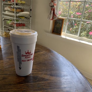 Smoothie King - a cup of coffee on a table - Juice Bars & Smoothies Near Me - Simpsonville, South Carolina Smoothie King - a cup of coffee on a table - Juice Bars & Smoothies Near Me - Simpsonville, South Carolina