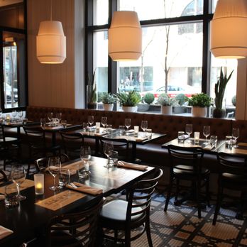 Cucina - a dining room with tables and chairs - Italian Near Me - Calgary, Alberta Cucina - a dining room with tables and chairs - Italian Near Me - Calgary, Alberta