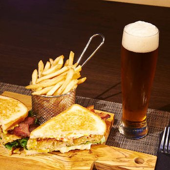 Midlands' -  a sandwich and french fries on a cutting board - Southern Near Me - Columbia, South Carolina